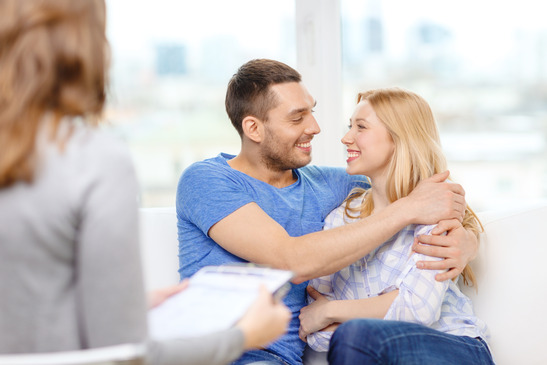 young couple hugging at psychologist office